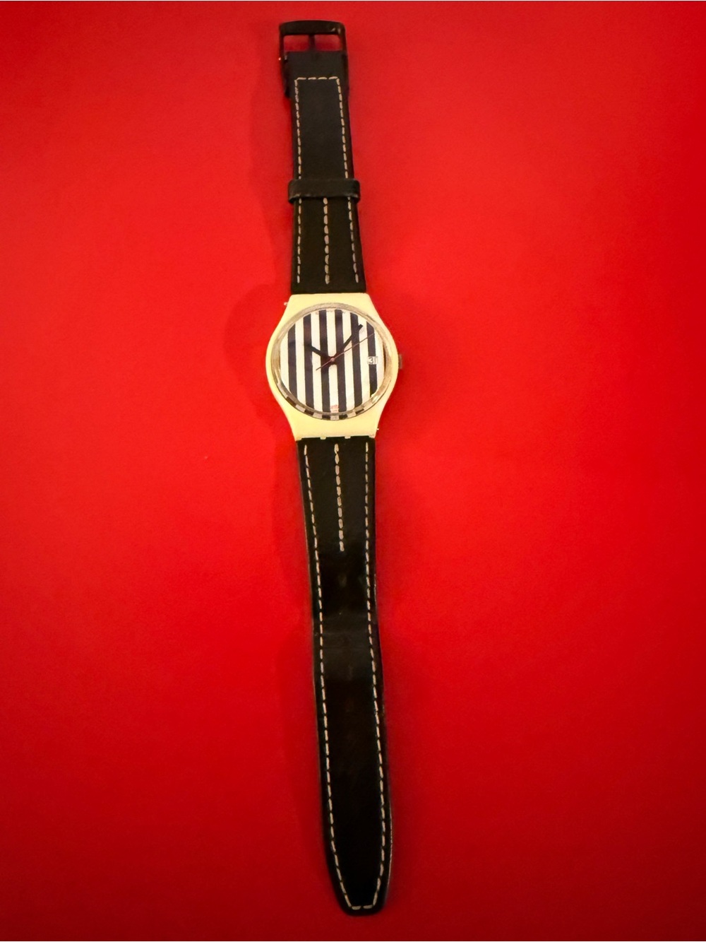 Swatch Black Strap Watch with Blue and White Striped Face